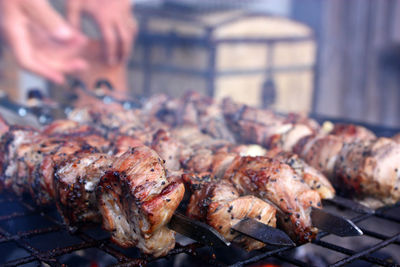 Close-up of meat on barbecue grill