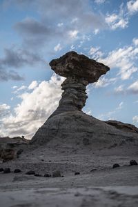 Low angle view of rock formations against sky