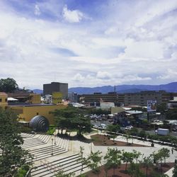 High angle view of town against cloudy sky