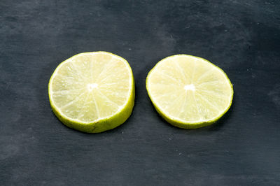 Close-up of lemon slice against black background