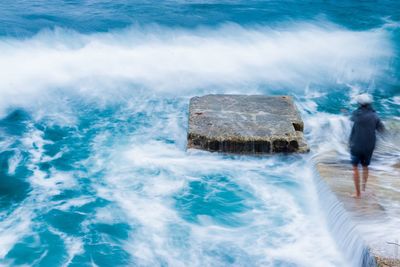 Digital composite image of water splashing on rocks