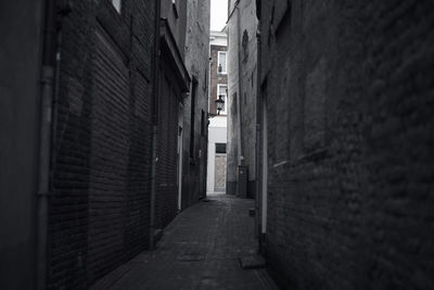 Corridor amidst buildings