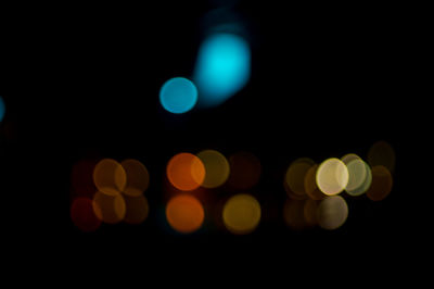 Defocused image of illuminated lights at night