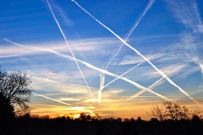 Low angle view of vapor trails in sky