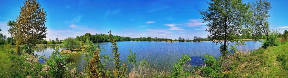 Scenic view of lake against blue sky