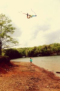 Person paragliding in sky