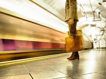 Blurred motion of train at railroad station