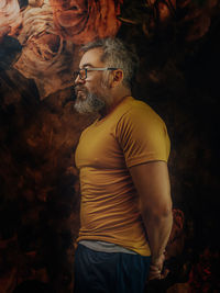 Midsection of man looking away outdoors