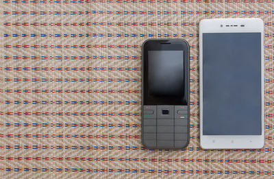 High angle view of smart phone on table