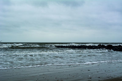 Scenic view of beach and sea against sky