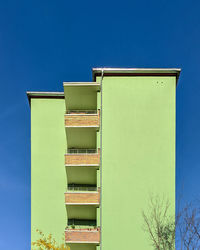 Low angle view of building against clear blue sky