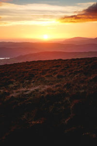 Scenic view of landscape against sky during sunset