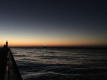 Scenic view of sea against clear sky during sunset