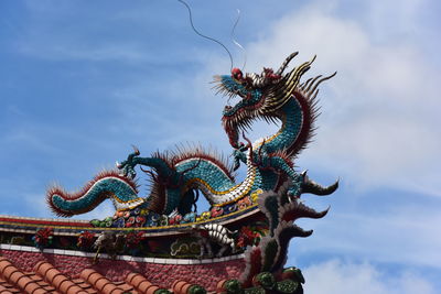 Low angle view of statue against sky