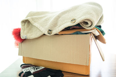 Low section of woman with gift box