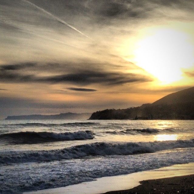 SCENIC VIEW OF SUNSET OVER SEA