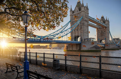 Bridge over river with city in background