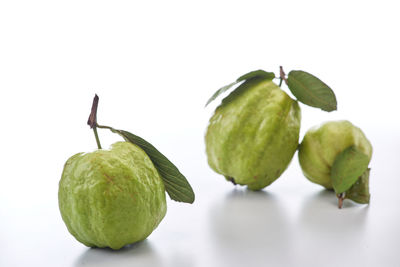 Close-up of fruits against white background