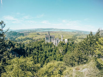 High angle view of trees and buildings against sky