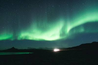 Scenic view of sea against sky at night