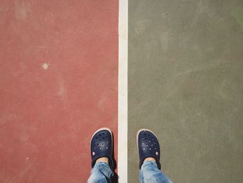 Low section of man standing on floor