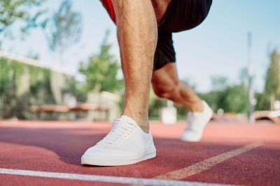 Low section of man with baby feet