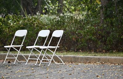 Empty chairs on field