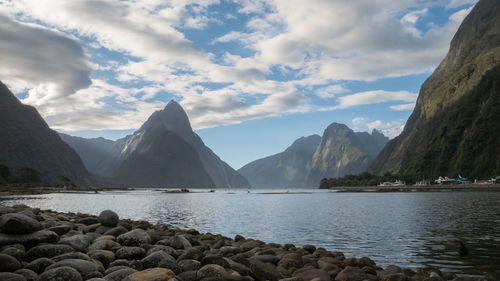 Landscape photo of fjord with tall peaks, milford sound, fiordland national park, new zealand