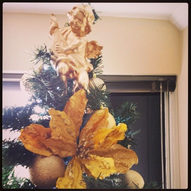 transfer print, auto post production filter, indoors, flower, art and craft, art, human representation, close-up, creativity, home interior, vase, window, wall - building feature, glass - material, statue, decoration, yellow, plant, no people, fragility
