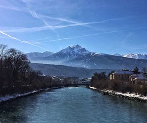 Scenic view of snowcapped mountains against sky during winter