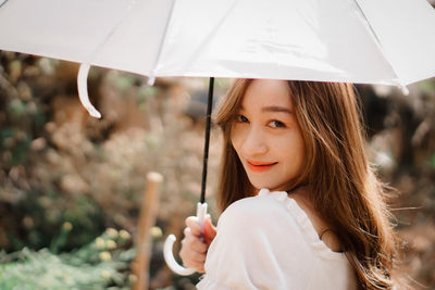 Portrait of woman holding girl