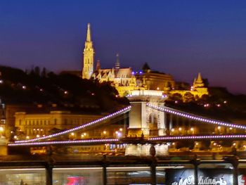 Low angle view of illuminated bridge at night