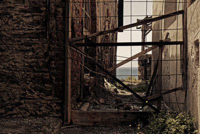 Abandoned building seen through broken window