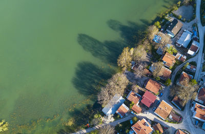 High angle view of buildings by sea