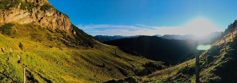 Scenic view of mountains against blue sky