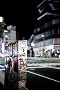 Close-up of illuminated city street at night