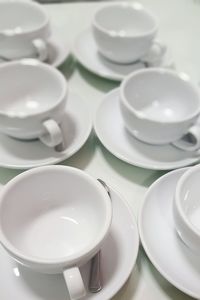 High angle view of empty coffee cups on table