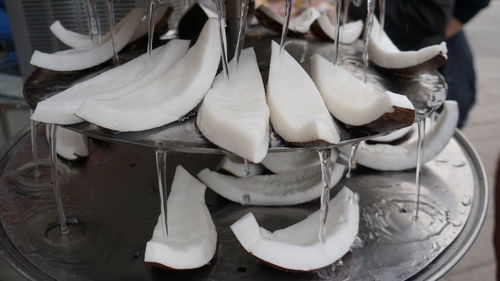 Water flowing from coconut slices