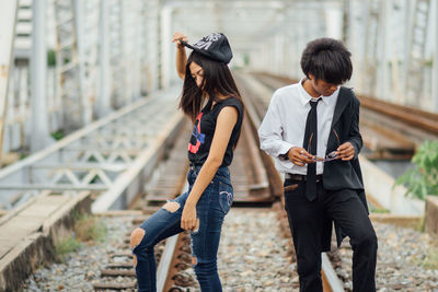 Side view of couple walking on street