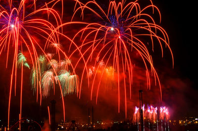 Low angle view of firework display at night