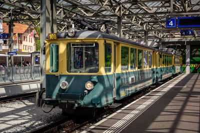 Train at railroad station in city