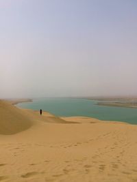 Scenic view of beach against clear sky