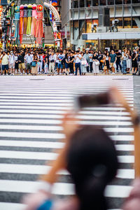 People walking on street in city