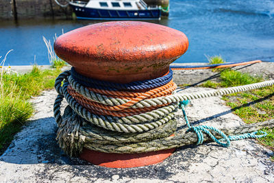 Close-up of rope tied to bollard