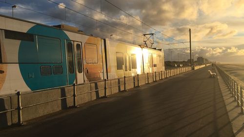 View of railway station against cloudy sky