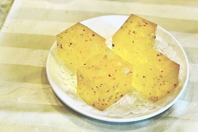 Close-up of yellow bread in plate