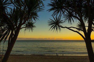 Scenic view of sea against sky at sunset