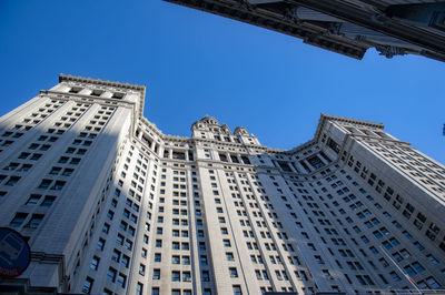 Low angle view of buildings against blue sky