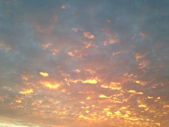 Low angle view of clouds in sky during sunset