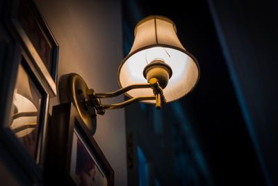 Low angle view of illuminated electric lamp